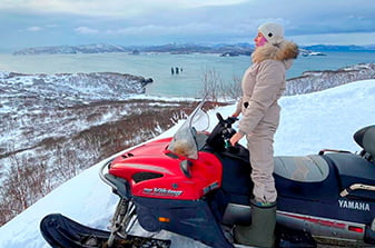 looking out over the ocean from the snowmobile