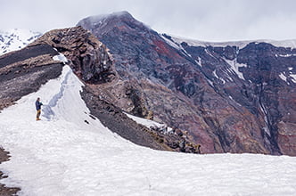a deep crater at the very summit