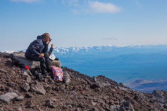 the group rests and has a snack after the ascent