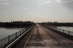 Road to the village of Klyuchi across the bridge