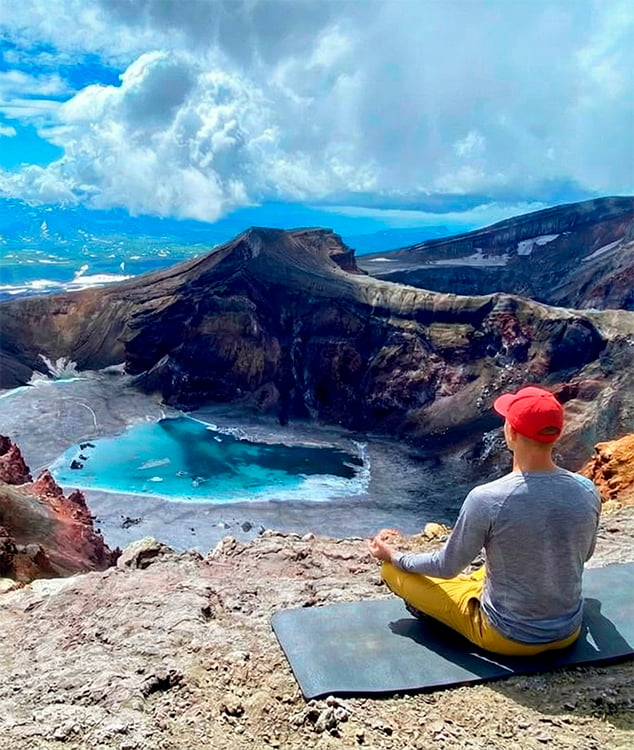 yoga against a mountain backdrop.